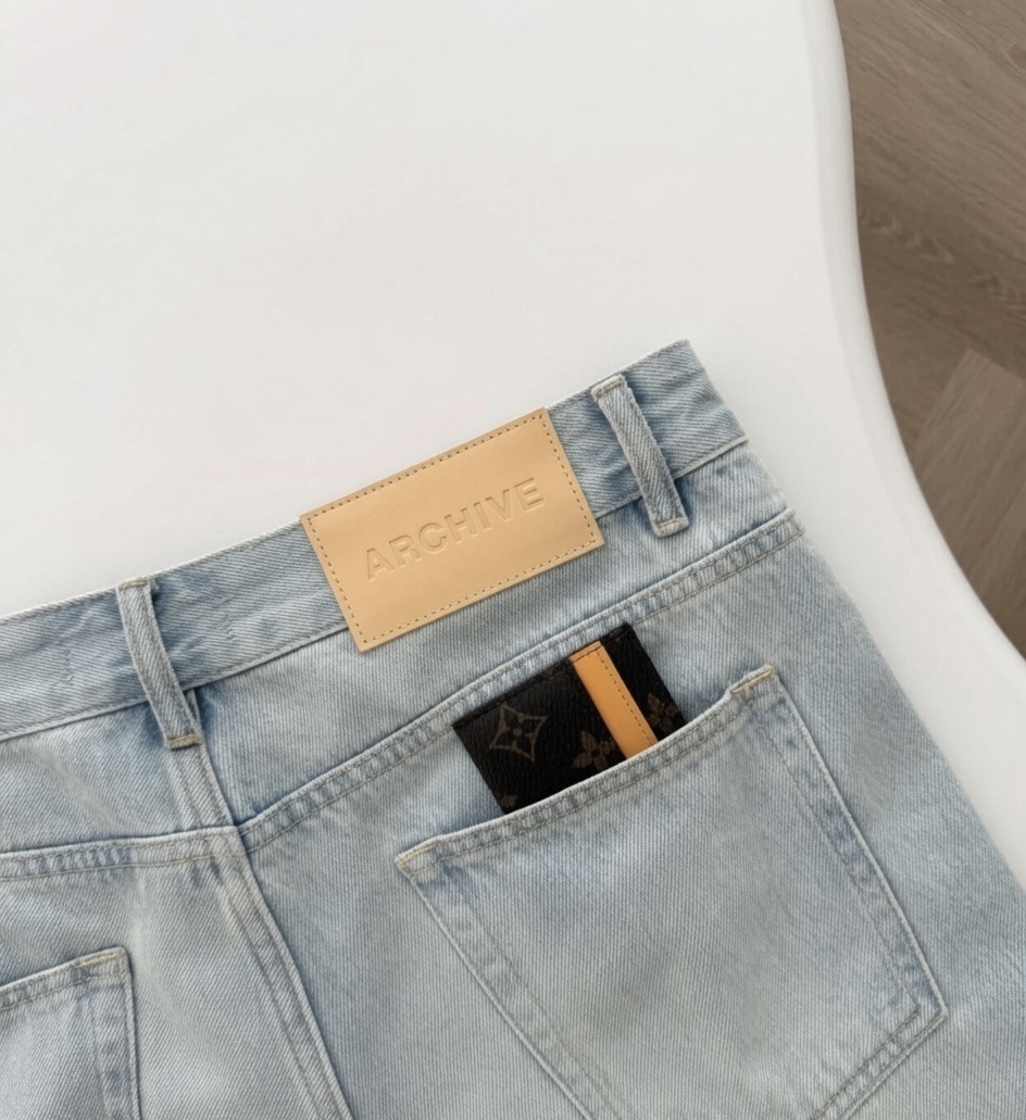 Archive denim jeans with embossed leather brand patch